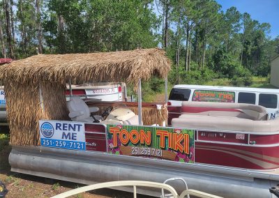 Side view of our Alabama Tiki Pontoon party boat rentals in Orange Beach